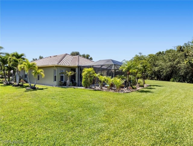 13708 Collina Ct, Estero, FL 33928 - view of grassy yard featuring a lanai