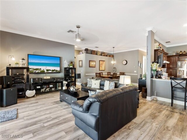 13708 Collina Ct, Estero, FL 33928 - living room with light wood-type flooring, ornamental molding, and a ceiling fan