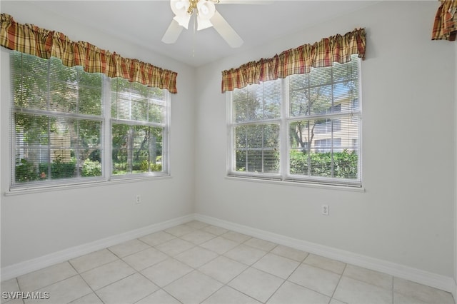 8380 Big Acorn Cir Unit 12A, Naples, FL 34119 - spare room featuring ceiling fan, light tile patterned floors, and baseboards