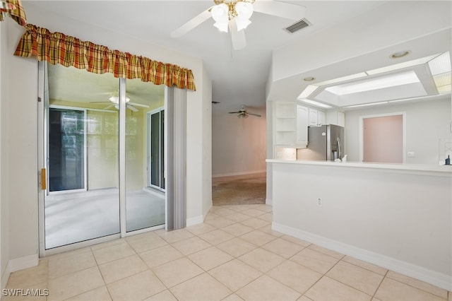 8380 Big Acorn Cir Unit 12A, Naples, FL 34119 - spare room featuring ceiling fan, light tile patterned flooring, and baseboards