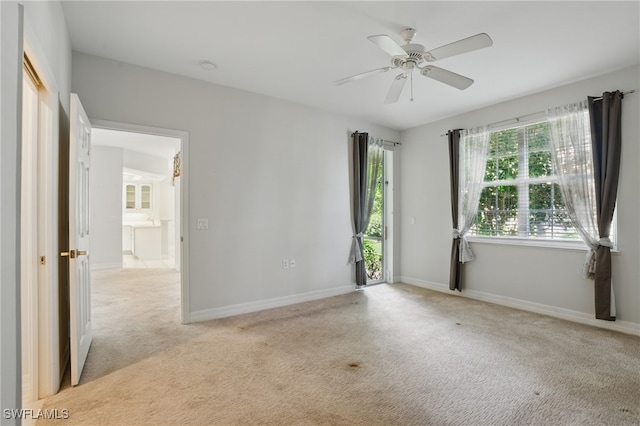 8380 Big Acorn Cir Unit 12A, Naples, FL 34119 - unfurnished room with light colored carpet, a ceiling fan, and baseboards