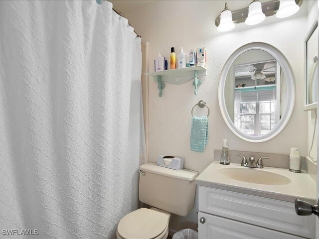 112 Marco Villas Dr Unit U2, Marco Island, FL 34145 - bathroom featuring vanity, toilet, and a shower with curtain