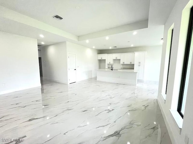 1218 Eclat St E, Lehigh Acres, FL 33974 - unfurnished living room with recessed lighting and baseboards