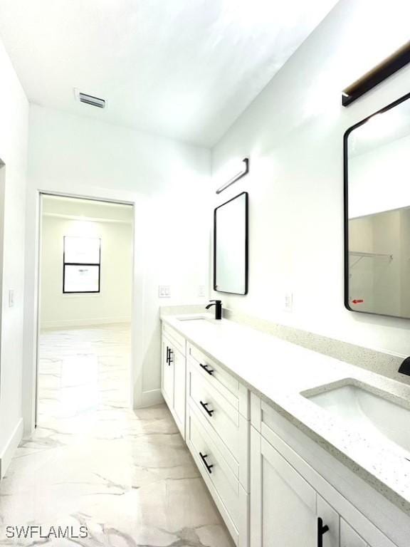 1218 Eclat St E, Lehigh Acres, FL 33974 - full bathroom with double vanity and marble look tiles