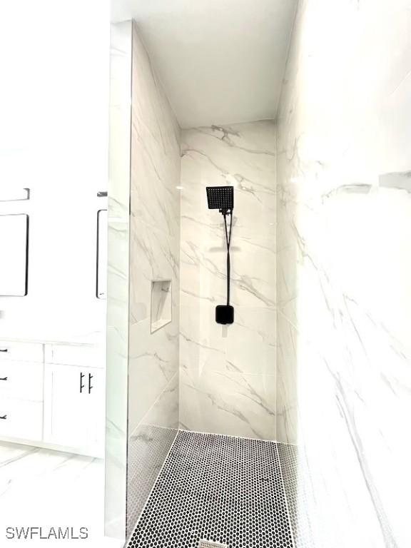 1218 Eclat St E, Lehigh Acres, FL 33974 - full bath featuring a marble finish shower and vanity