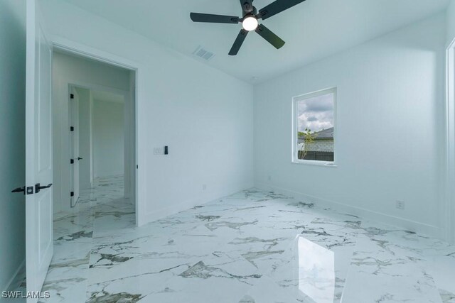 341 NE 31st Ter, Cape Coral, FL 33909 - spare room with a ceiling fan, baseboards, and marble finish floors