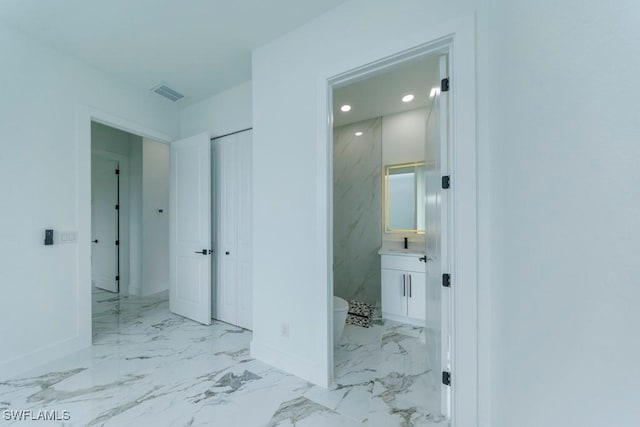 341 NE 31st Ter, Cape Coral, FL 33909 - hallway with baseboards, marble finish flooring, and recessed lighting