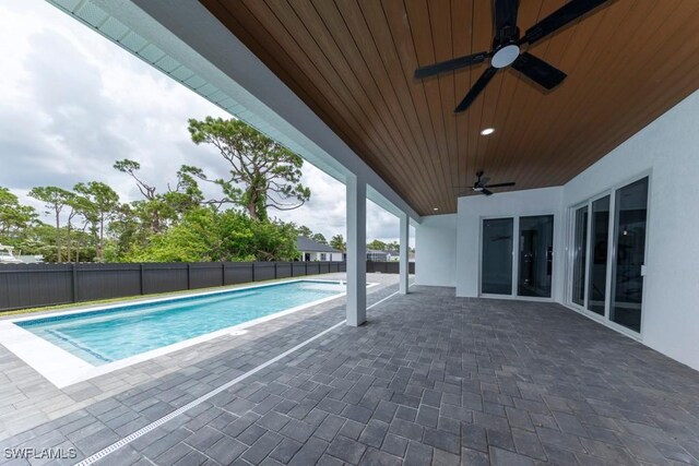 341 NE 31st Ter, Cape Coral, FL 33909 - view of pool with ceiling fan, a fenced backyard, and a patio area
