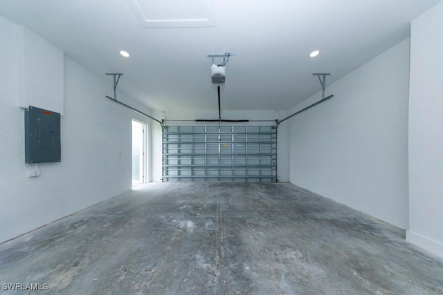 341 NE 31st Ter, Cape Coral, FL 33909 - garage featuring electric panel, a garage door opener, and recessed lighting
