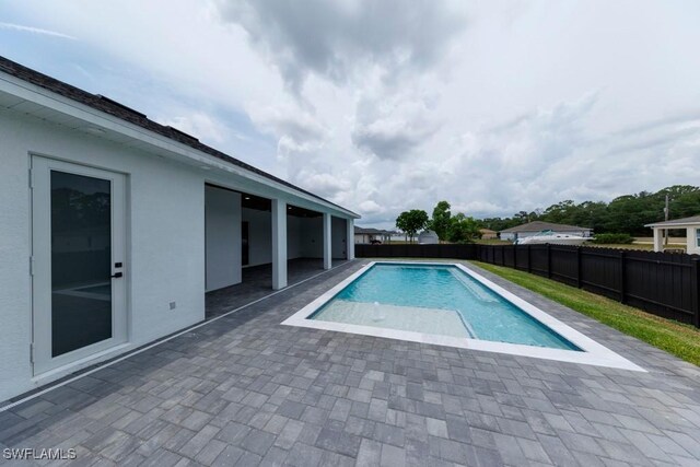341 NE 31st Ter, Cape Coral, FL 33909 - view of pool featuring a patio and a fenced backyard