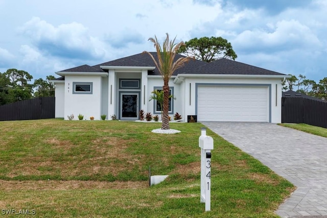 341 NE 31st Ter, Cape Coral, FL 33909 - view of front facade featuring stucco siding, an attached garage, and decorative driveway
