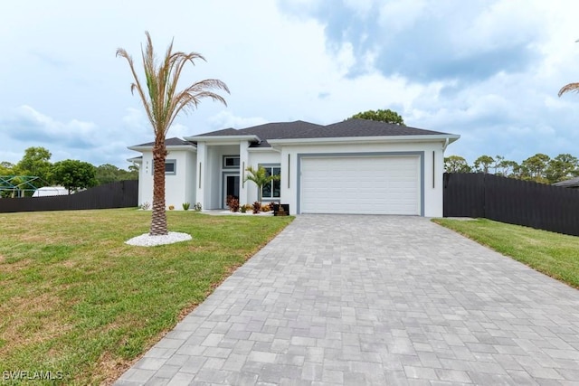 341 NE 31st Ter, Cape Coral, FL 33909 - view of front of property with stucco siding, an attached garage, and decorative driveway