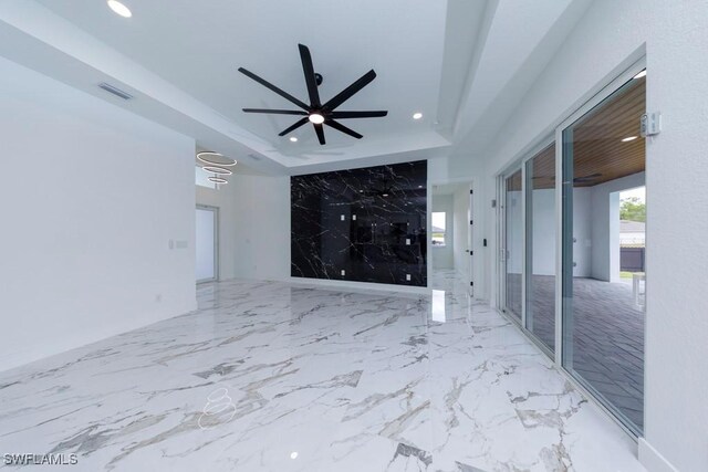 341 NE 31st Ter, Cape Coral, FL 33909 - unfurnished living room with recessed lighting, a raised ceiling, and a ceiling fan
