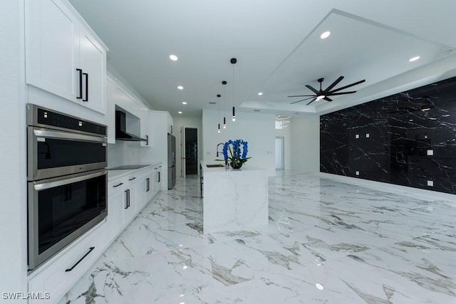 341 NE 31st Ter, Cape Coral, FL 33909 - kitchen with stainless steel appliances, recessed lighting, wall chimney exhaust hood, white cabinets, and ceiling fan
