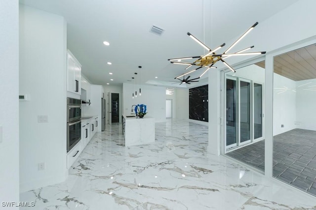 341 NE 31st Ter, Cape Coral, FL 33909 - unfurnished living room featuring a chandelier, recessed lighting, and light marble finish flooring