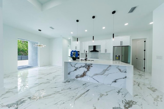 341 NE 31st Ter, Cape Coral, FL 33909 - kitchen featuring stainless steel fridge with ice dispenser, wall chimney exhaust hood, white cabinetry, a sink, and light marble finish flooring