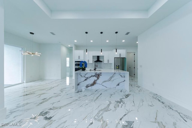 341 NE 31st Ter, Cape Coral, FL 33909 - unfurnished living room with recessed lighting, light marble finish flooring, and a sink