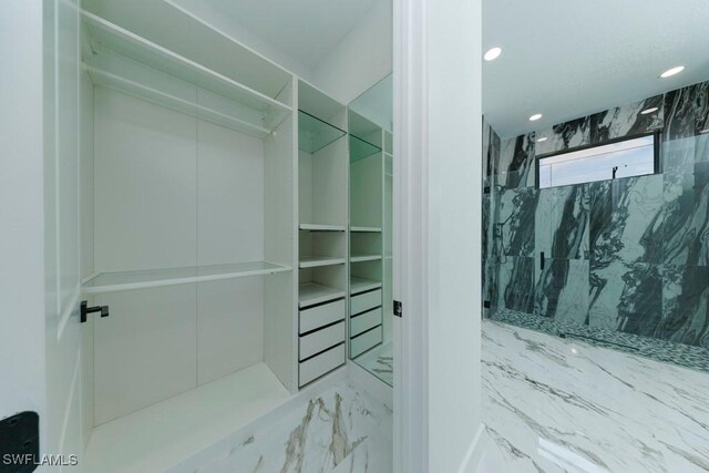 341 NE 31st Ter, Cape Coral, FL 33909 - walk in closet featuring marble finish flooring