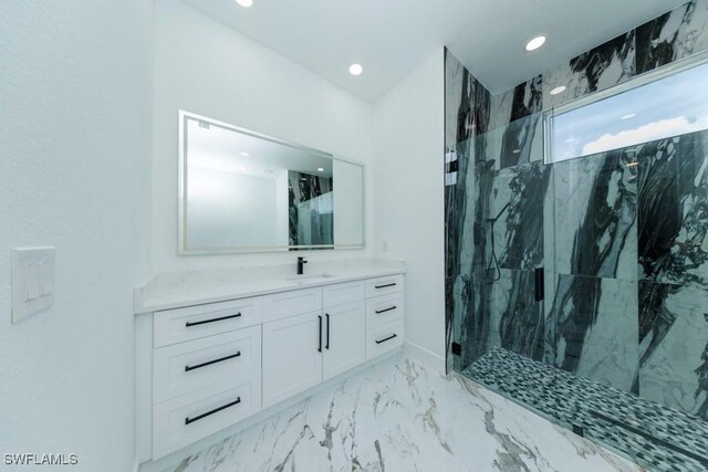 341 NE 31st Ter, Cape Coral, FL 33909 - bathroom with a marble finish shower, vanity, recessed lighting, and marble finish flooring