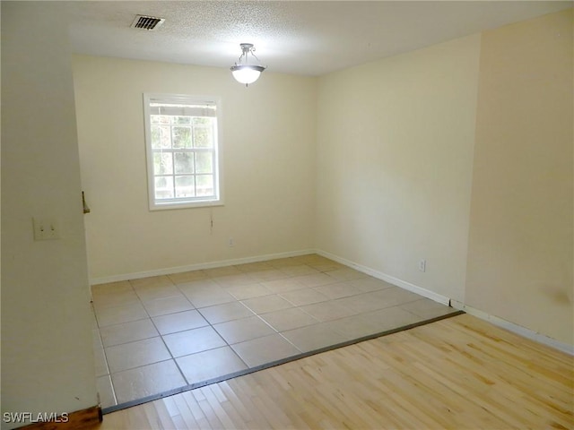 3611 8th Ave SE, Naples, FL 34117 - tiled empty room featuring baseboards