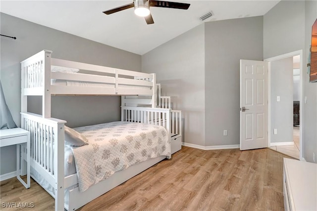 2128 SW 8th Ct, Cape Coral, FL 33991 - bedroom featuring wood finished floors, lofted ceiling, baseboards, and a ceiling fan