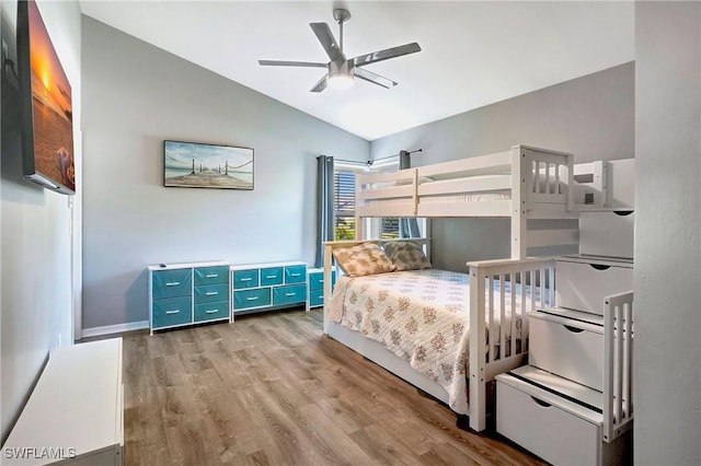 2128 SW 8th Ct, Cape Coral, FL 33991 - bedroom featuring vaulted ceiling, light wood finished floors, a ceiling fan, and baseboards