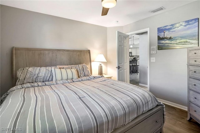 2128 SW 8th Ct, Cape Coral, FL 33991 - bedroom featuring dark wood-style floors, baseboards, and ceiling fan