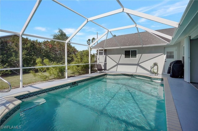 2128 SW 8th Ct, Cape Coral, FL 33991 - outdoor pool with glass enclosure and a patio area