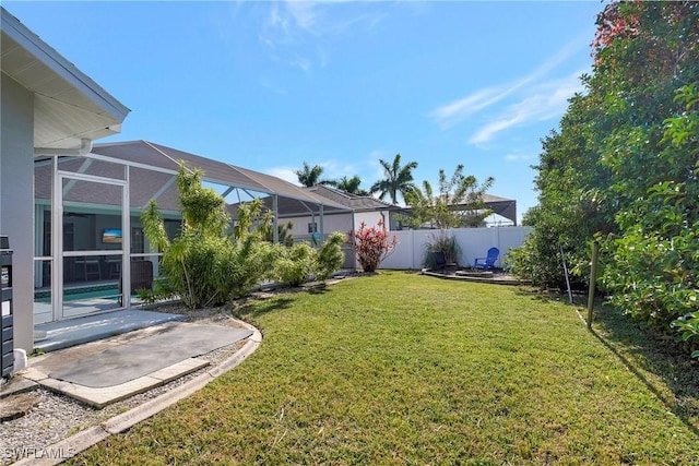 2128 SW 8th Ct, Cape Coral, FL 33991 - view of yard featuring a patio area and glass enclosure