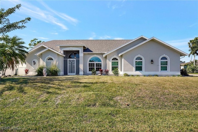 2128 SW 8th Ct, Cape Coral, FL 33991 - ranch-style house featuring stucco siding, a front yard, and a shingled roof