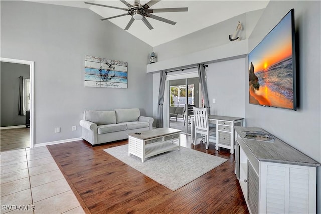 2128 SW 8th Ct, Cape Coral, FL 33991 - living area with high vaulted ceiling, ceiling fan, baseboards, and dark wood-style floors