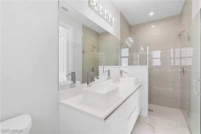 679 18th St NE, Naples, FL 34120 - full bath with a shower stall, double vanity, toilet, recessed lighting, and marble finish flooring