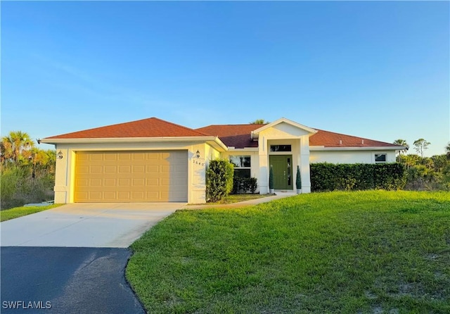2640 36th Ave SE, Naples, FL 34117 - ranch-style home with a garage, a front lawn, stucco siding, and concrete driveway