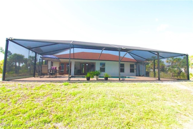2640 36th Ave SE, Naples, FL 34117 - rear view of property featuring a lanai, a yard, and a patio
