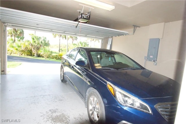 2640 36th Ave SE, Naples, FL 34117 - garage featuring electric panel and a garage door opener