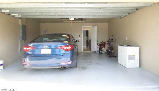 2640 36th Ave SE, Naples, FL 34117 - garage with electric panel and fridge