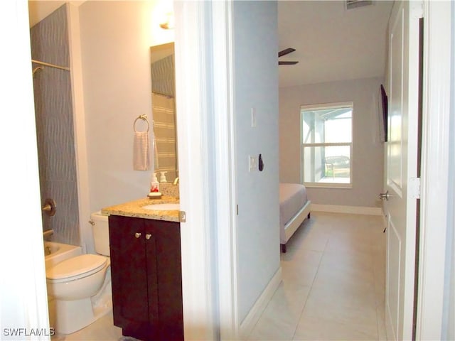 2640 36th Ave SE, Naples, FL 34117 - full bath with tile patterned flooring, toilet, vanity, baseboards, and  shower combination