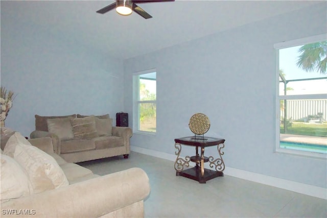 2640 36th Ave SE, Naples, FL 34117 - living room featuring ceiling fan and baseboards