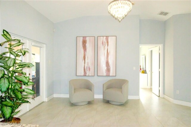 2640 36th Ave SE, Naples, FL 34117 - sitting room with vaulted ceiling, a chandelier, baseboards, and tile patterned floors