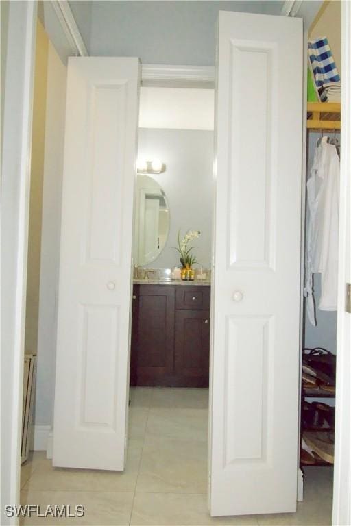 2640 36th Ave SE, Naples, FL 34117 - bathroom featuring vanity, a closet, and tile patterned flooring