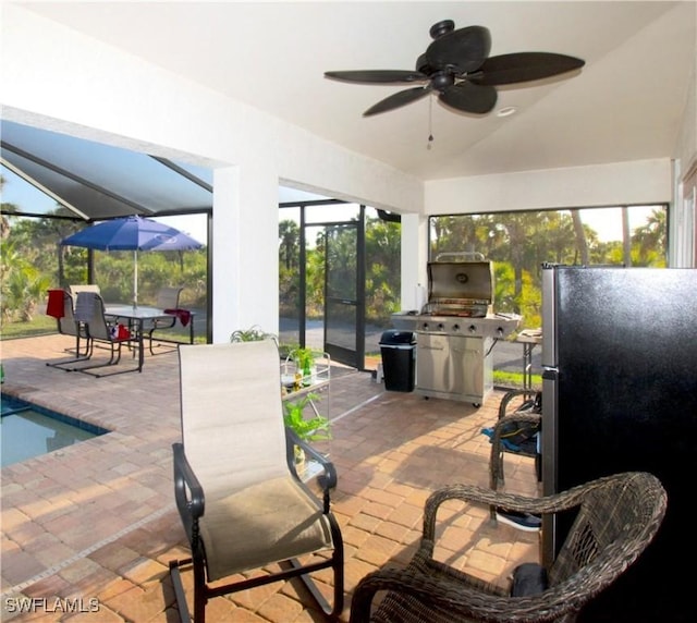 2640 36th Ave SE, Naples, FL 34117 - view of patio / terrace featuring a ceiling fan, glass enclosure, an outdoor pool, and grilling area