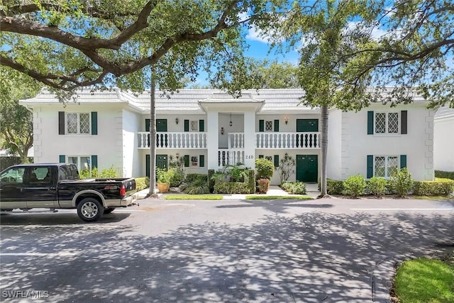240 Palm River Blvd Unit C202, Naples, FL 34110 - view of front facade featuring stucco siding and a balcony