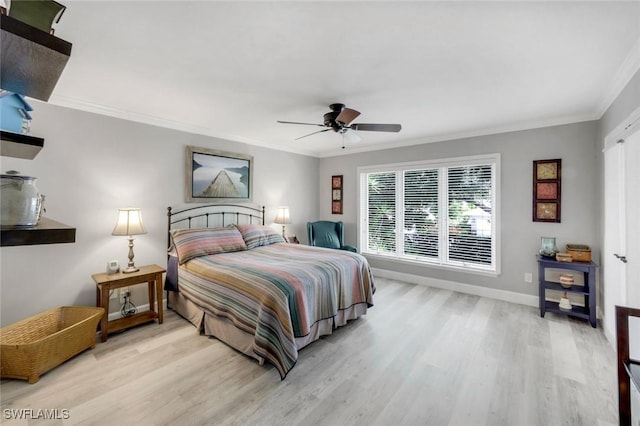 240 Palm River Blvd Unit C202, Naples, FL 34110 - bedroom with ornamental molding, light wood-style floors, baseboards, and ceiling fan
