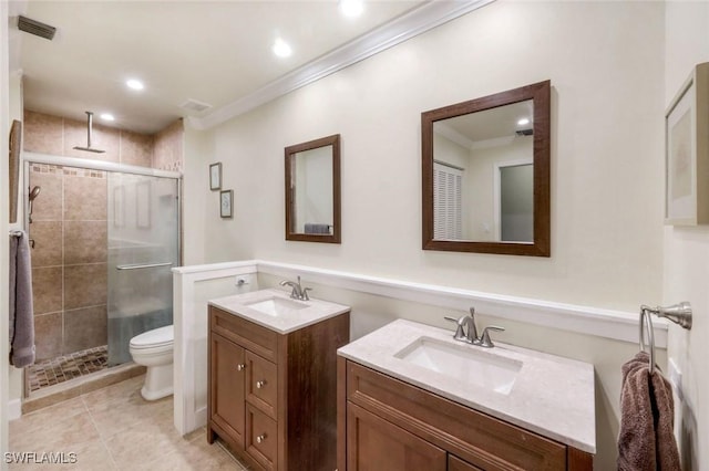 240 Palm River Blvd Unit C202, Naples, FL 34110 - full bathroom with a stall shower, ornamental molding, two vanities, toilet, and tile patterned flooring