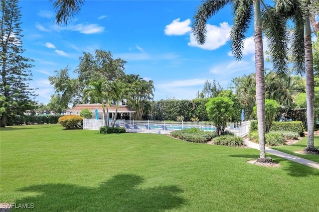 240 Palm River Blvd Unit C202, Naples, FL 34110 - view of yard featuring an outdoor pool