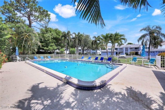 240 Palm River Blvd Unit C202, Naples, FL 34110 - community pool featuring fence and a patio