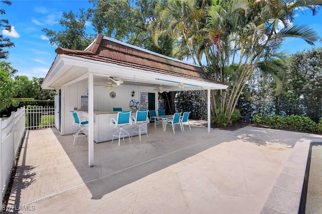 240 Palm River Blvd Unit C202, Naples, FL 34110 - view of patio / terrace featuring a ceiling fan and fence