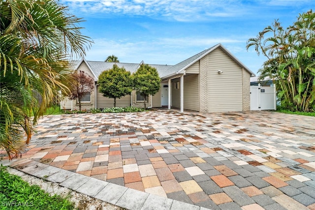 4617 Lombardy Ln, Naples, FL 34112 - view of front of home with roof with shingles