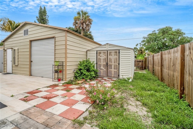 4617 Lombardy Ln, Naples, FL 34112 - garage with fence and a storage shed
