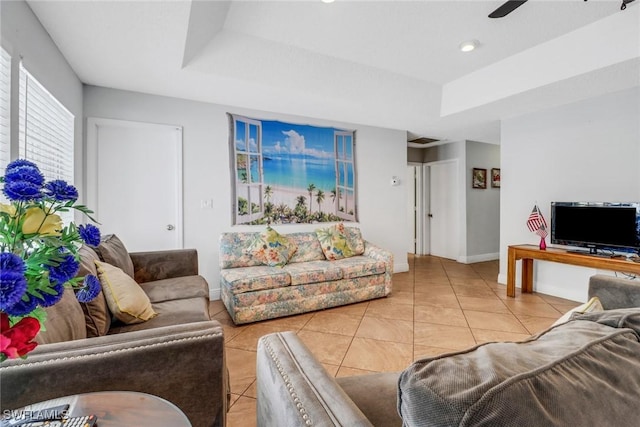 4617 Lombardy Ln, Naples, FL 34112 - living area featuring tile patterned floors, baseboards, a raised ceiling, and ceiling fan